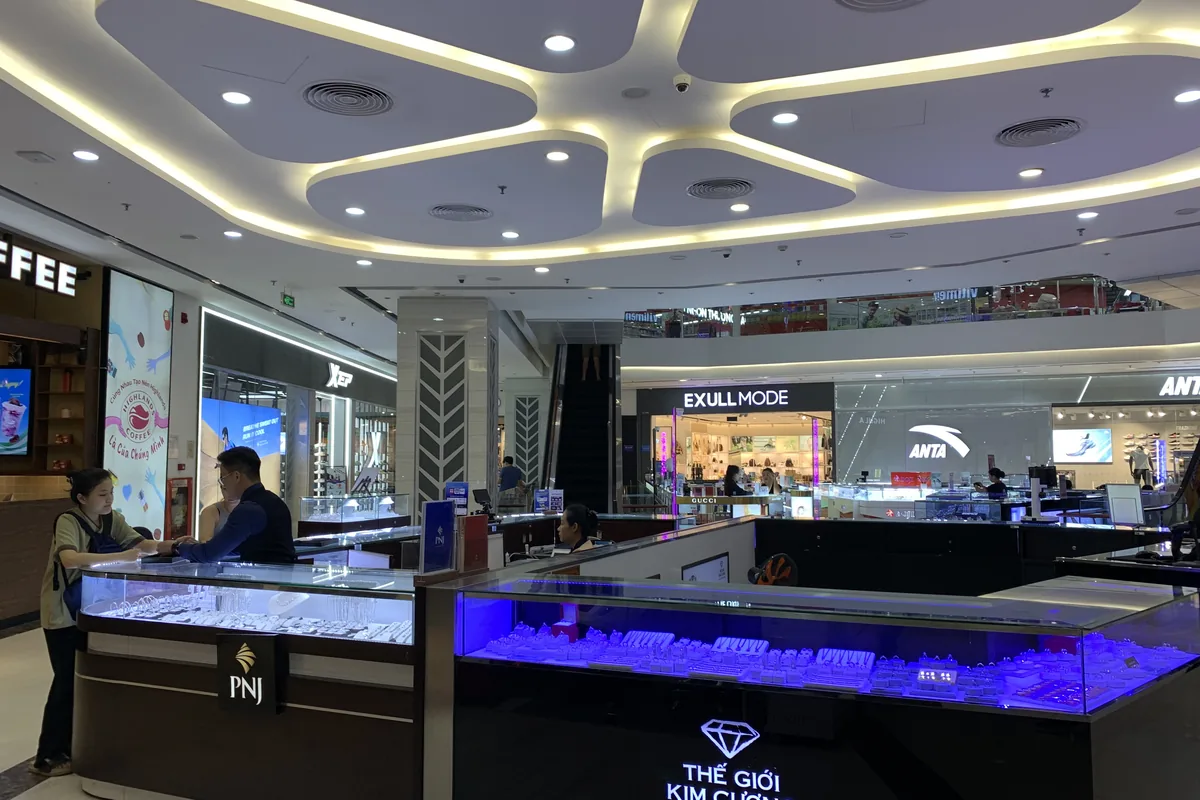 Vincom Plaza shopping mall atrium with glass elevators and escalators